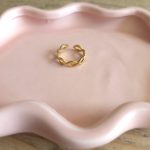 Goudkleurige verstelbare ring met gevlochten infinity-design – Studio Glow Jewels