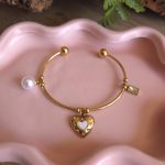 Goudkleurige bedelarmband met parel en hartje – Studio Glow Jewels